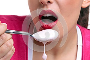 Eating yoghurt close up