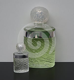 Eau de Rochas, fragrance for ladies, large perfume bottle next to a commercial perfume bottle