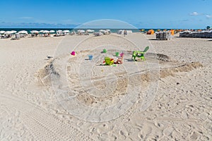 Eautiful landscape view of Miami South  Beach coast line. Atlantic Ocean, Cute view of colorful sand toys on sandy beach. photo