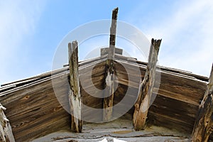 Eaves of on old pioneer log cabin as seen from the ground