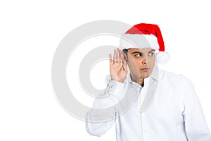 Eavesdopping mean young man in santa hat