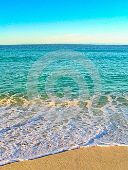 Ebb and flow of the ocean at a beach in the Bay of Fires, Tasmania, Australia.