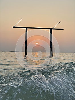 Ebb and flow of waves at a beach in Omadhoo Island