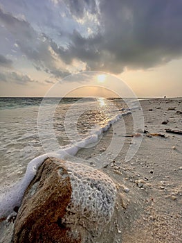 Ebb and flow of waves at a beach in Omadhoo Island
