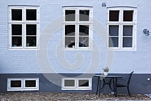 Ebeltoft street cafe blue brick wall background