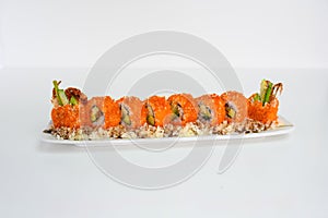 Ebiko breadcrumb filled avocado, kani, tamago, cucumber pickle sushi roll with teriyaki sauce