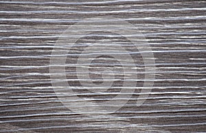 Ebon wood, natural dark wood surface with white stripes close-up photo