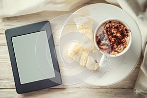 Ebook and a cup of hot cocoa