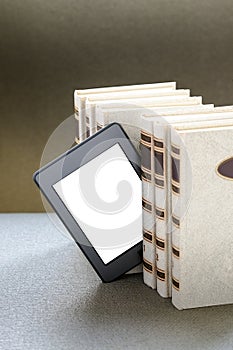 Ebook and old books on table