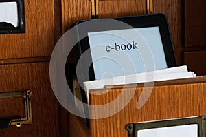 Ebook Reader in a Library - New Technology Concept