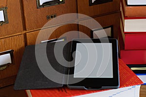 Ebook Reader in a Library - New Technology Concept