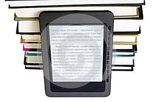 Ebook reader on pile books