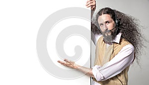 Eccentric man pointng on the empty board