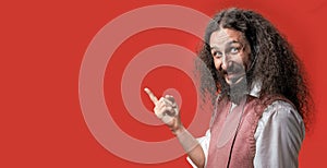 Eccentric telemarketer posing over a red background