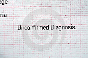 ECG ElectroCardioGraph paper that shows unconfirmed diagnosis of abnormal cardiac electrical impulses and myocardial ischemia,