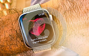 Ecg - man hand with Apple Watch series 4 with ECG app illustration, display photo