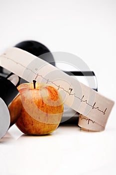 ECG tracing, apple, dumbbell