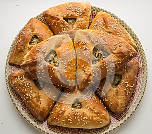 Echpochmak - meat pies, potatoes and greens.