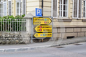 Echternach, Luxembourg - 04 27 2024: Street signs to several cities in Luxembourg and around