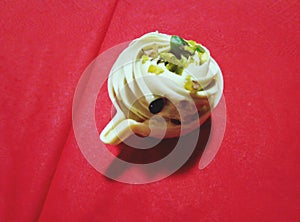 Eclair like cup of coffee with chocolate nutt cream photo