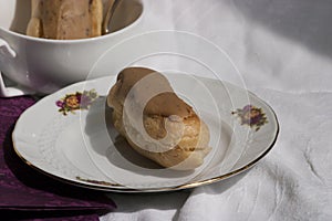 Coffee flavored eclair on a plate