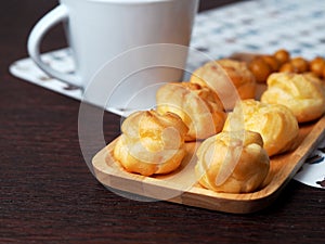 Eclair on wood tray