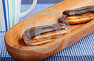 Eclairs on blue table cloth