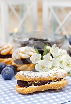 Eclairs with blueberry marmalade