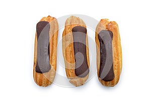Eclairs with chocolate icing isolated on a white background. Confectionery
