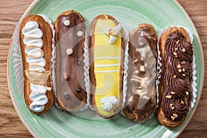 Eclairs with different ganache and icing with different toppings