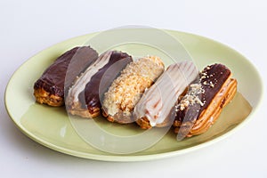 Eclairs different species on a plate