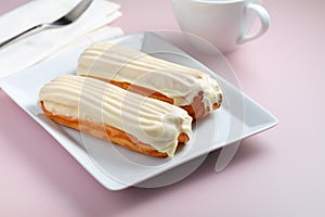 Eclairs with White Chocolate Glaze on a plate