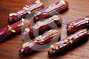 Eclairs on wooden table close-up