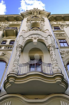 Eclectic facade with a balcony