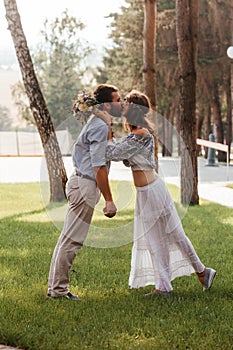 Eclectic rustic wedding couple. Intimate ceremony at backyard