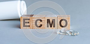 ECMO is a word written in black letters on wooden cubes