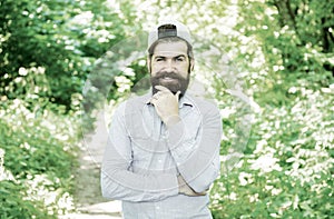 Eco activist. Man handsome bearded guy in sunny forest. United with environment. Go green think fresh. Earth day