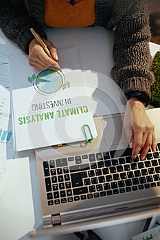 eco aware business. business woman working with documents in office