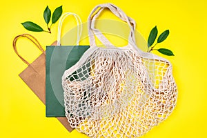 Eco Bags.A variety of eco bags on a yellow background . Sustainable lifestyle.Zero waste minimal composition with tring