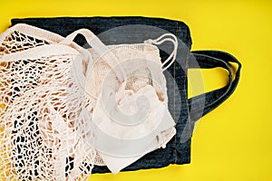 Eco Bags.A variety of eco bags on a yellow background . Sustainable lifestyle.Zero waste minimal composition with tring