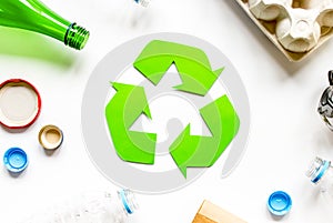 Eco concept with recycling symbol on table background top view