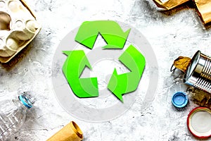 Eco concept with recycling symbol on table background top view