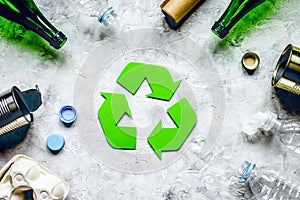 Eco concept with recycling symbol on table background top view