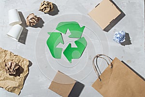 Eco concept with recycling symbol on table background top view