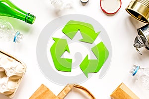 Eco concept with recycling symbol on table background top view