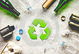 Eco concept with recycling symbol on table background top view