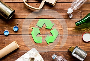 Eco concept with recycling symbol on table background top view