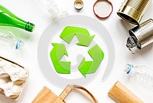 Eco concept with recycling symbol on table background top view