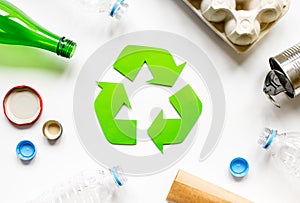 Eco concept with recycling symbol on table background top view