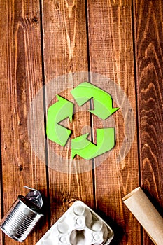 Eco concept with recycling symbol on table background top view m